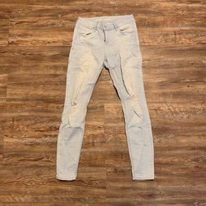 mid-rise distressed light wash skinny jeans